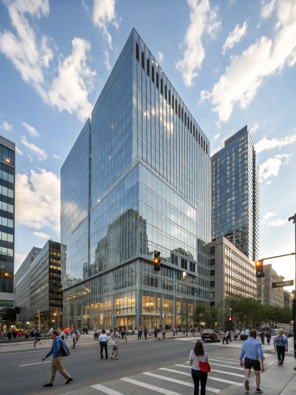 A modern glass building in London, UK, with a tech conference banner displayed prominently. The sky is slightly overcast, typical of London weather, creating a professional and sophisticated atmosphere.